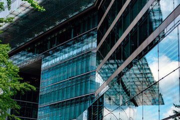 Modern architecture showcases reflective glass design in urban environment