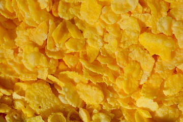 Close-up pile of crispy, golden-yellow cornflakes