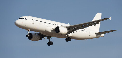 The plane lands.Airplane, passengers flying in the blue sky, preparing to land at the airport