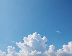 A clear blue sky with soft, white clouds.