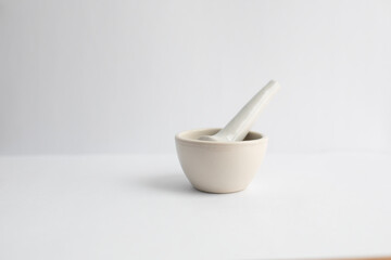 Mortar and pestle on a white background with copy space