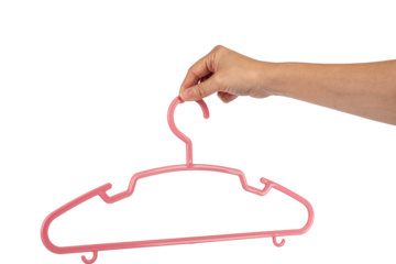 Plastic clothes hanger in hand isolated on transparent background 