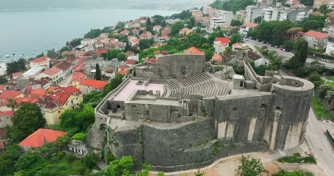 Drone flight over Montenegro Herceg Novi old town waterfront amphitheatre