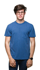 Young handsome man wearing glasses over isolated background with serious expression on face. Simple and natural looking at the camera.