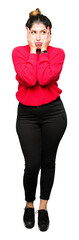 Young beautiful woman wearing red sweater and bun Tired hands covering face, depression and sadness, upset and irritated for problem
