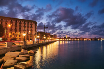 Obraz premium view of Bari, Southern Italy, the region of Puglia, Apulia seafront at dusk. Basilica San Nicola in the background.