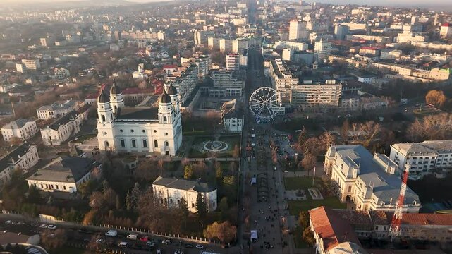 Iasi&rsquo;s Metropolitan Cathedral, Ștefan cel Mare Boulevard, and Ferris Wheel in Aerial Video