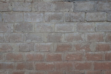 Rough surface of whitewashed wall made of concrete masonry units