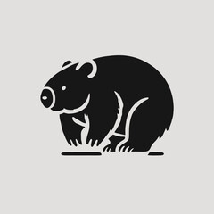 very simple flat and minimalist Wombat silhouette in black on a white background