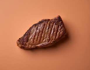 Naklejka premium Carnivore meat steak against mocha mousse background