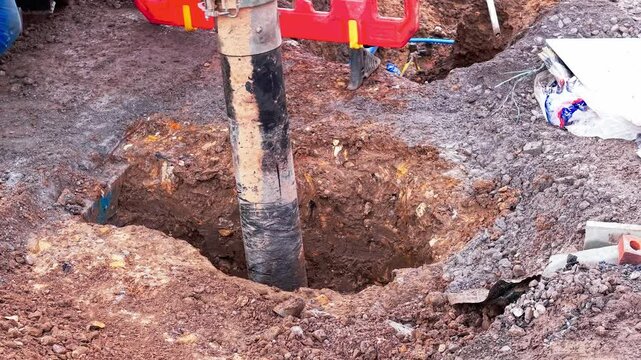 Construction team performs vacuum excavation work at a site aroung existing underground services