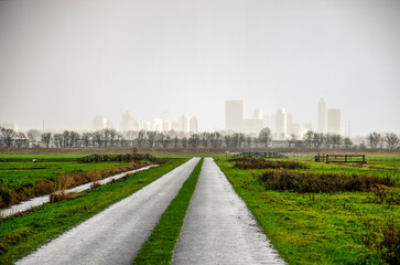 Bike road in polder Schieveen near Rotterdam, The Netherlands, under dramatic weather cicumstances,...