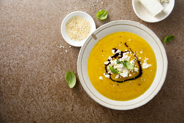 Homemade pumpkin soup with Feta cheese