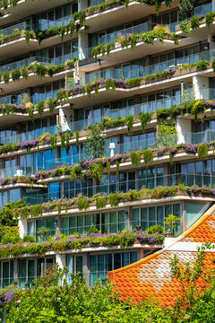 A modern architectural marvel featuring integrated greenery design, beautifully combining urban living with nature, emphasizing sustainability and artistic expression in living spaces  in Amsterdam