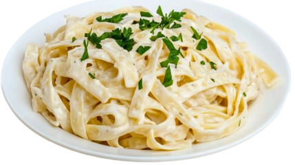 A plate of creamy alfredo fettuccine pasta topped with fresh herbs like parsley and basil, served on a pristine white plate. This homemade dish offers an elegant take on classic Italian cuisine.