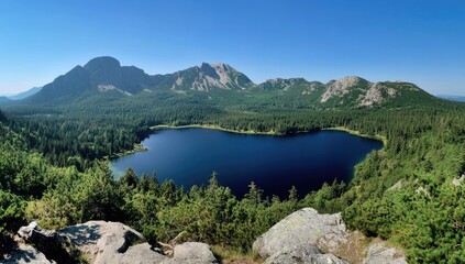 A serene lake reflects the bright blue sky, embraced by rolling green hills and majestic mountains. The peaceful atmosphere invites exploration and appreciation of nature's beauty