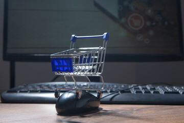 Shopping cart with a computer keyboard. Online Shopping