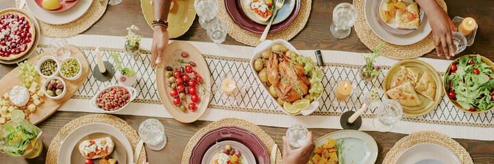 Website banner with unrecognizable people taking plates with delicious food