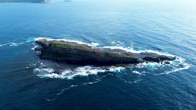 Drone aerial landscape of Wasp Island ocean coastline reef headland rocks in Batemans Bay South Durras Australia waves nature travel tourism diving holidays