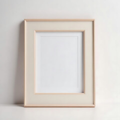 A photo frame with a neutral-colored border, photographed on a white surface.
