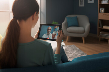 Woman having a video call with her doctor