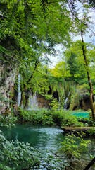Obraz premium Transparent Turquoise Colored Waters of the Lake Are Having Ripples. Many Small Waterfalls Flowing Into the Lake. Plitvice Lakes, National Park, Croatian Scenery, Waterfall Views, Natural Beauty