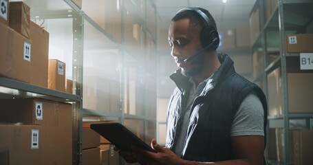 African American Customer Support Specialist in Logistics, Manager Talks on Call Using Headset,...