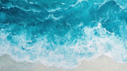 Obraz premium Aerial view of turquoise ocean waves breaking on sandy beach.
