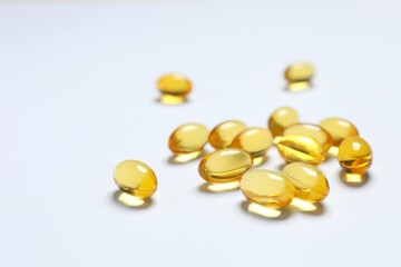 Capsule of omega 3, 6, 9 fish oil, vitamin, food supplement on white background 