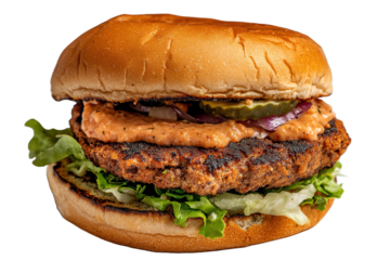 Delicious burger with toasted buns, lettuce, grilled patty, special sauce, pickles, and red onions on transparent background