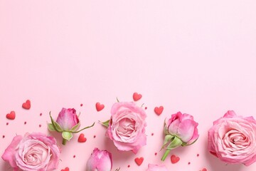 Beautiful composition with pink roses on color background