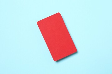 Red paper card on color background
