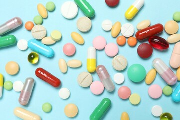 Various pills on color background