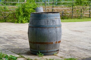 Large wooden barrels placed in the aisle