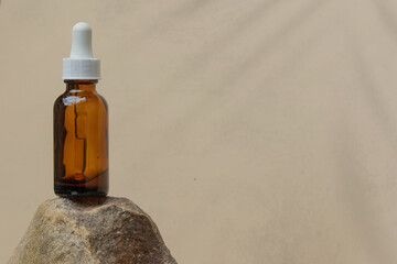 A minimalist concept highlighting a skincare bottle on a textured stone, ideal for product presentations.