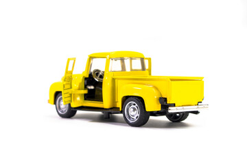 Yellow pickup truck toy isolated on white background. Children's toys. Transport concept