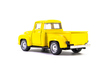 Yellow pickup truck toy isolated on white background. Children's toys. Transport concept