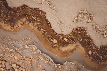 Obraz premium a textured background with a top view of the loose surface of sand and earth soil.