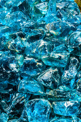 A pile of blue glass pieces