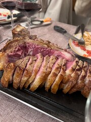 T-bone steak is neatly sliced.