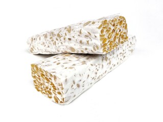 Two pieces of tempeh or soybeans fermentation isolated on white background. Indonesian food 