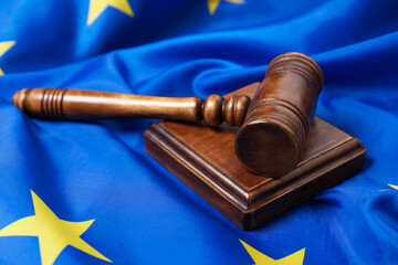 Judge's gavel on flag of European Union, closeup