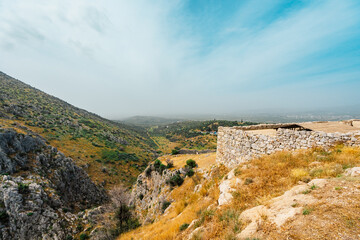 The archaeological site of Mycenae with ancient tombs, giant walls and lions gate, Peloponnese, Greece