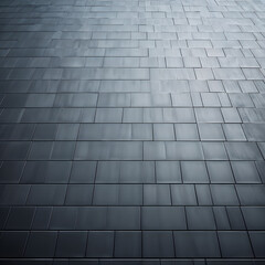 Textured gray background in the form of a wall of facing tiles of different sizes with a matte finish