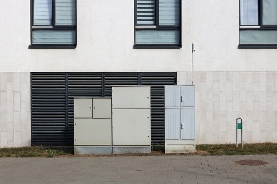 Modern power electrical distribution boxes near a residential building