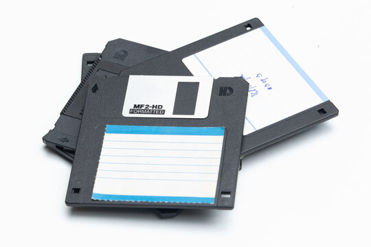 A clean and clear image of a vintage floppy disk set against a plain white background.