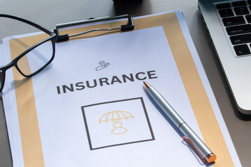 A medical insurance form neatly arranged with a stethoscope and pen on a professional table.
