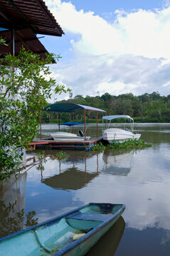 sierpe river and boats docked at pier in town of sierpe costa rica