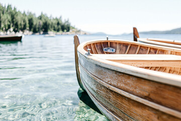 Obraz premium wooden fishing boats anchored, emerald bay vista