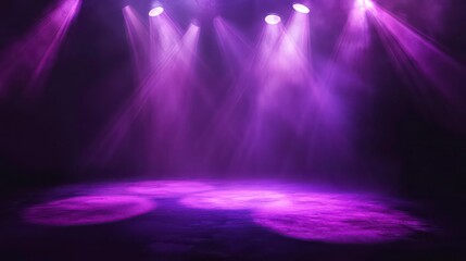 Purple stage lights illuminate a smoky empty stage.